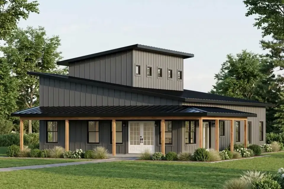 Front elevation rendering of Plan 405151FDC — asymmetrical shed roofs anchored by a raised clerestory monitor with a band of small square windows, deep columned front porch running the full width of the living wing, vertical board-and-batten siding in neutral tones, dark standing-seam metal roof