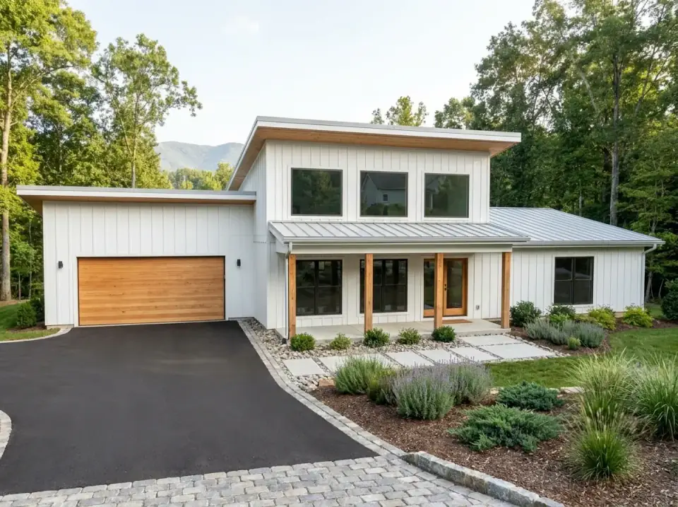 Scandi-Modern Farmhouse facade variant with crisp white board-and-batten siding, light-toned warm wood accents on upper volume porch columns and garage door, light grey standing-seam metal roof, large concrete paver walkway separated by gravel bands, neat planting beds of lavender and ornamental grasses