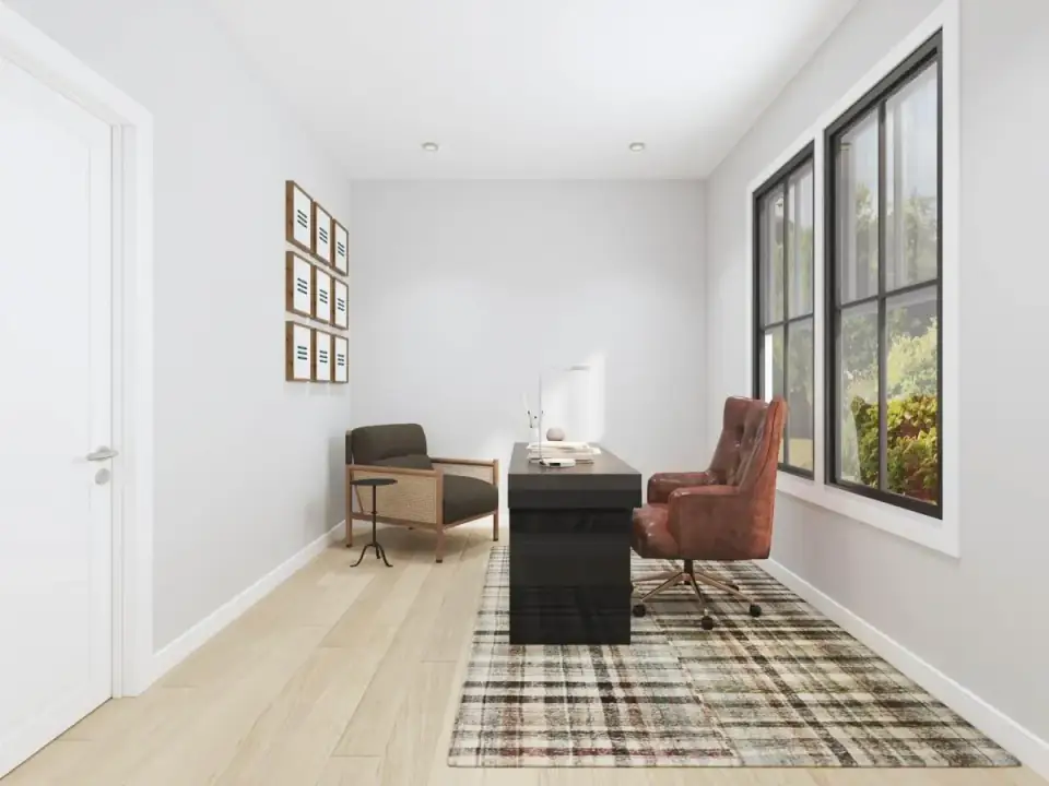 Great room with a fireplace in a dark surround and wood mantel, wide-plank light oak floors and black-framed windows