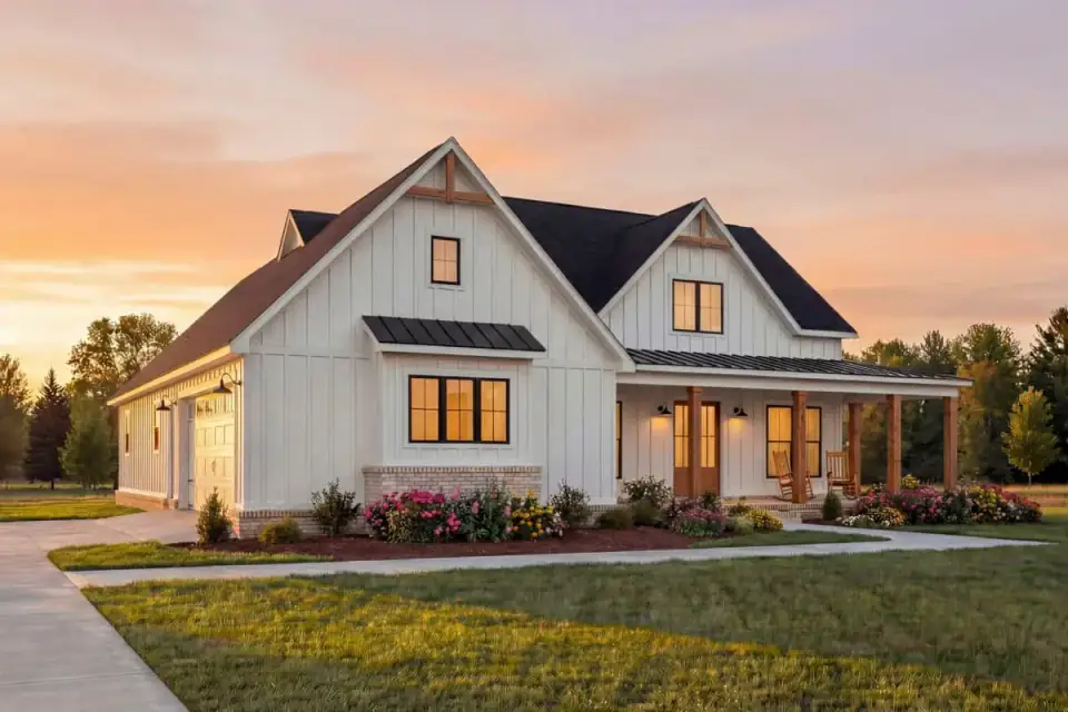 Side elevation of the single-story farmhouse showing the gable composition and metal awning accents