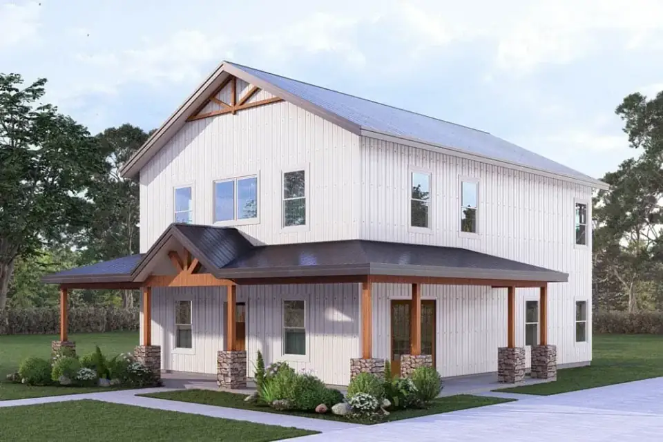 Front elevation rendering of barndominium plan 405153FDC with central gable, lower-slope wraparound porch roof, two-tone vertical board-and-batten siding, stone piers at the porch columns, exposed timber truss in the porch bay, balanced double-hung windows on the upper level, and dark standing-seam metal roof